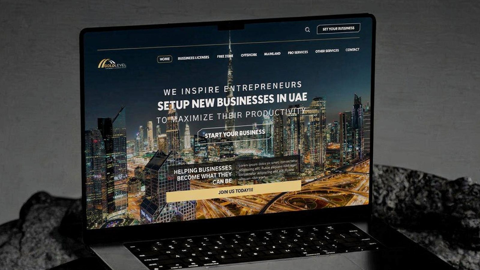 Gold Level UAE business setup website design mockup displayed on a laptop